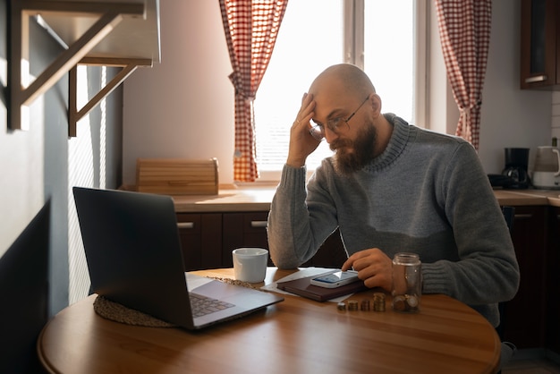 Man saving money during energy crisis