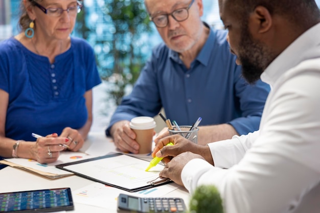 Insurance broker highlighting the important contract terms
